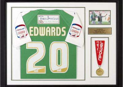 Framed Edwards shirt and medal
