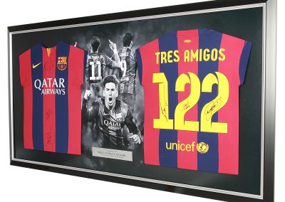 Framed double FC Barcelona shirt with photographic background