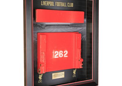 Framed original seat from Liverpool Football Club in display case
