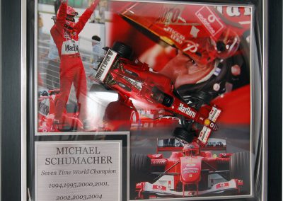 Framed Schumacher model car in dome